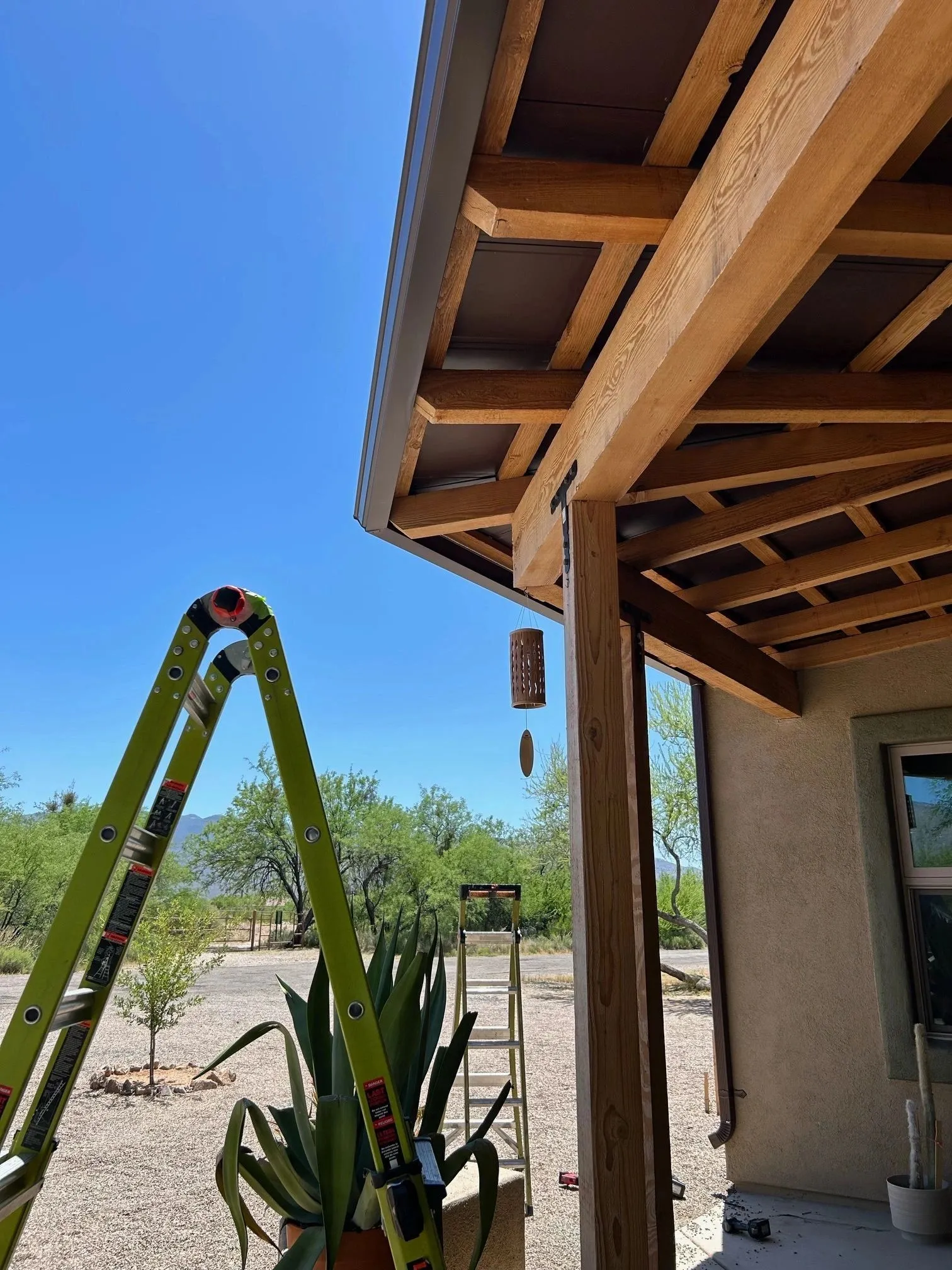 Patio cover wood framing prepped for metal soffit panels at a desert Arizona home
